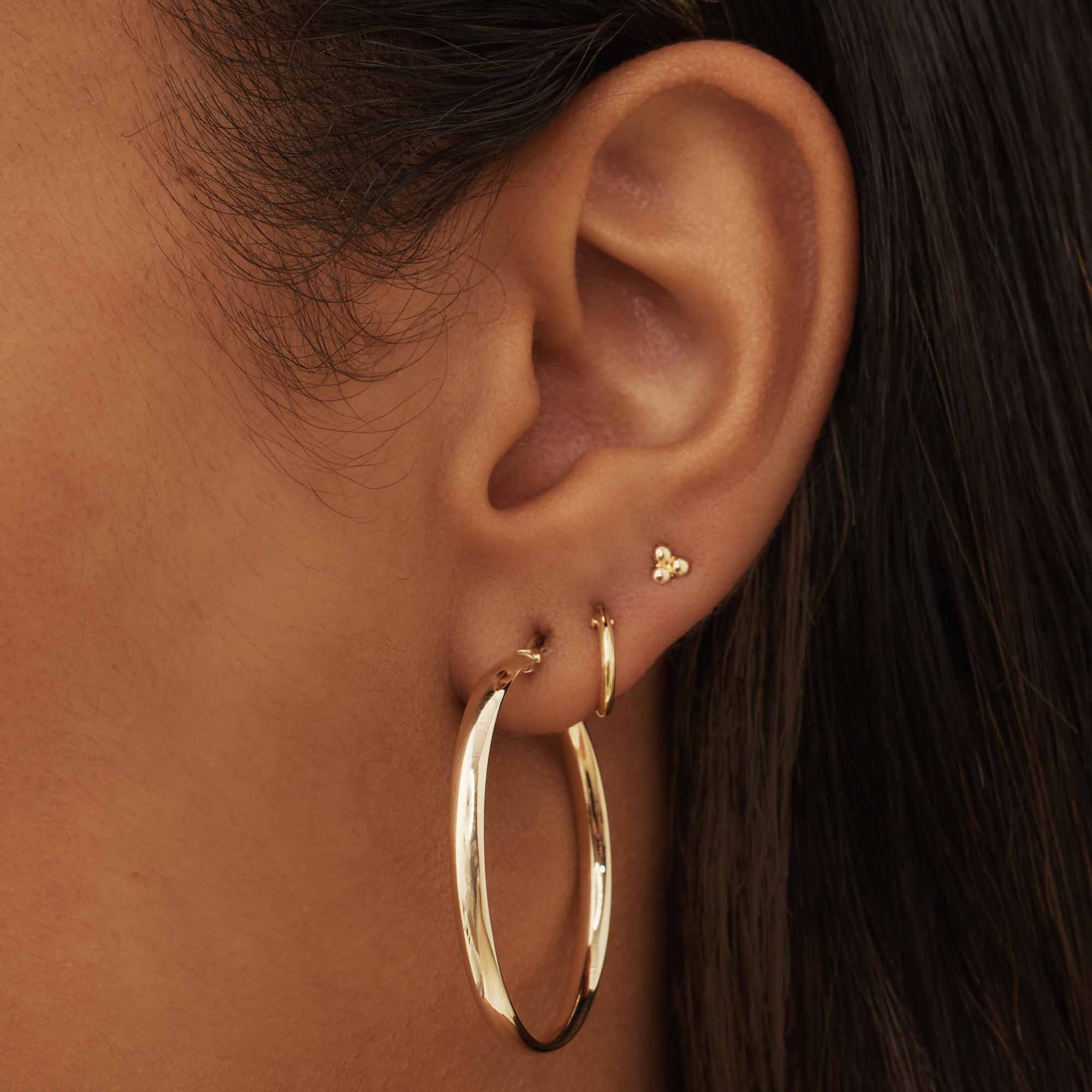Rivoli Estrella 14 karat gold hoop earrings (32 mm)