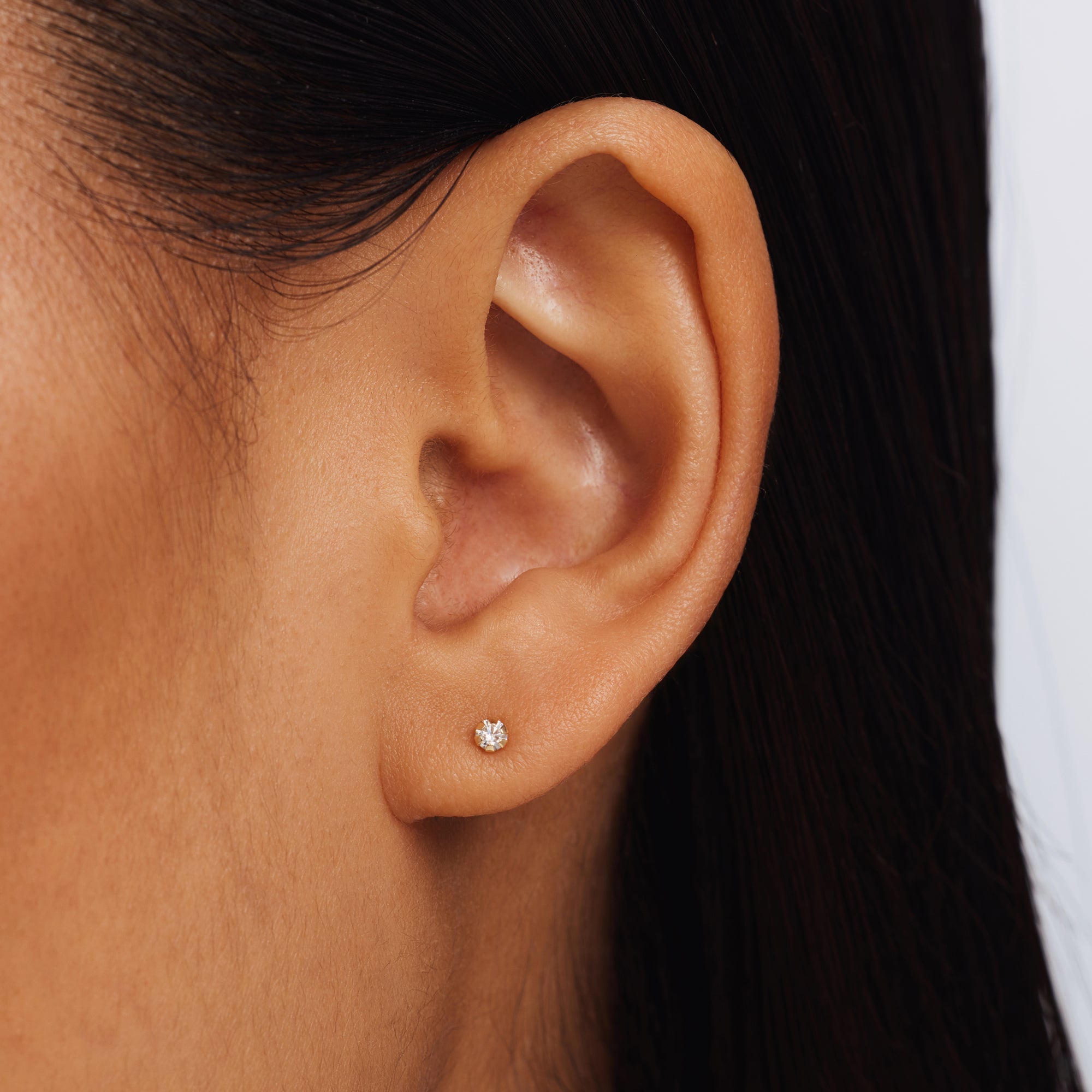 Le Marais De Buci 14 karat gold ear studs with zirconia stones