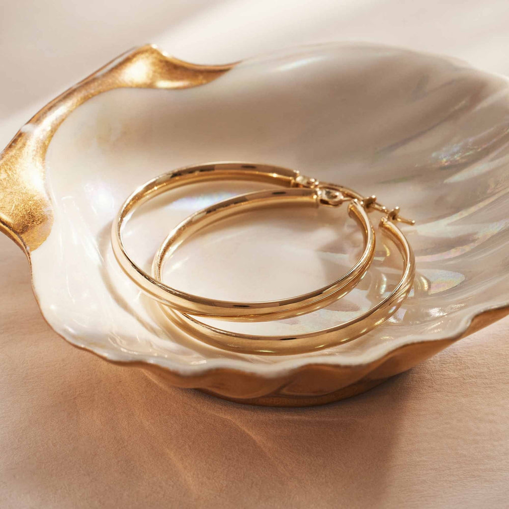 Rivoli Estrella 14 karat gold hoop earrings (32 mm)