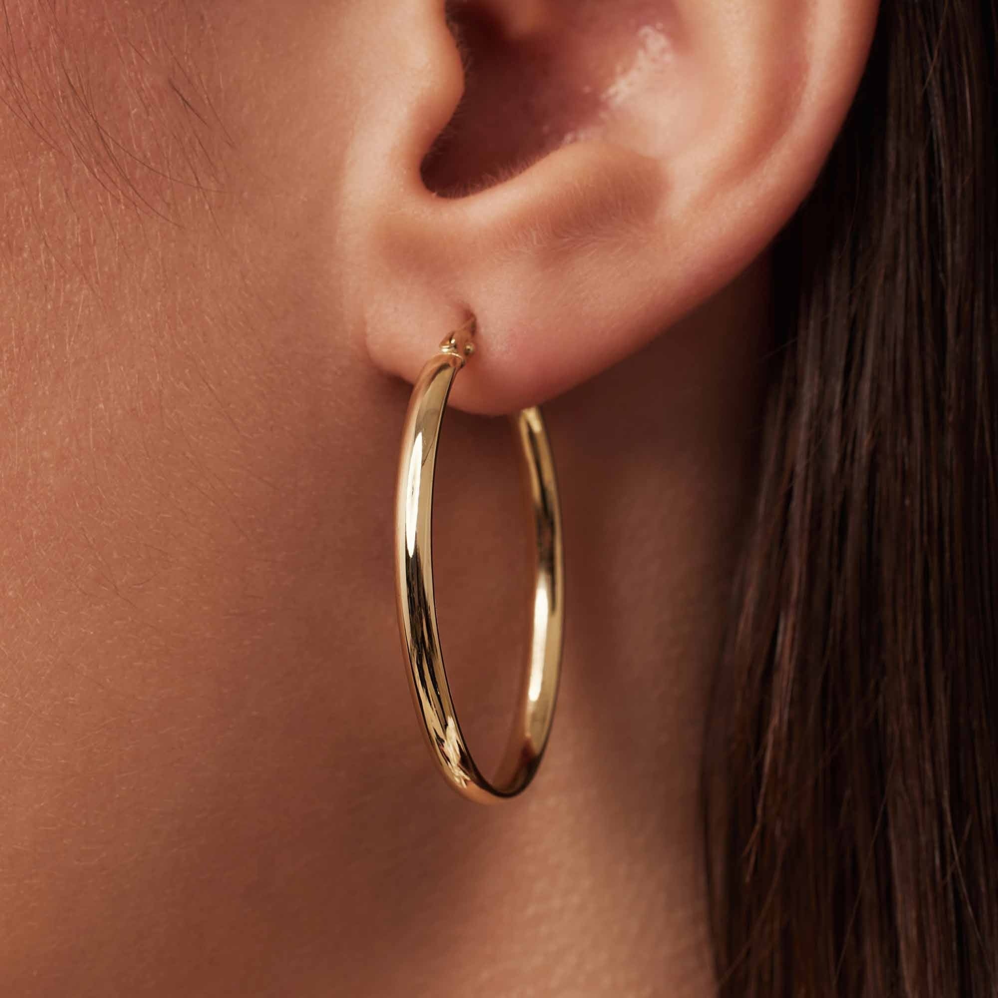 Rivoli Flori 14 karat gold oval hoop earrings (34 mm)