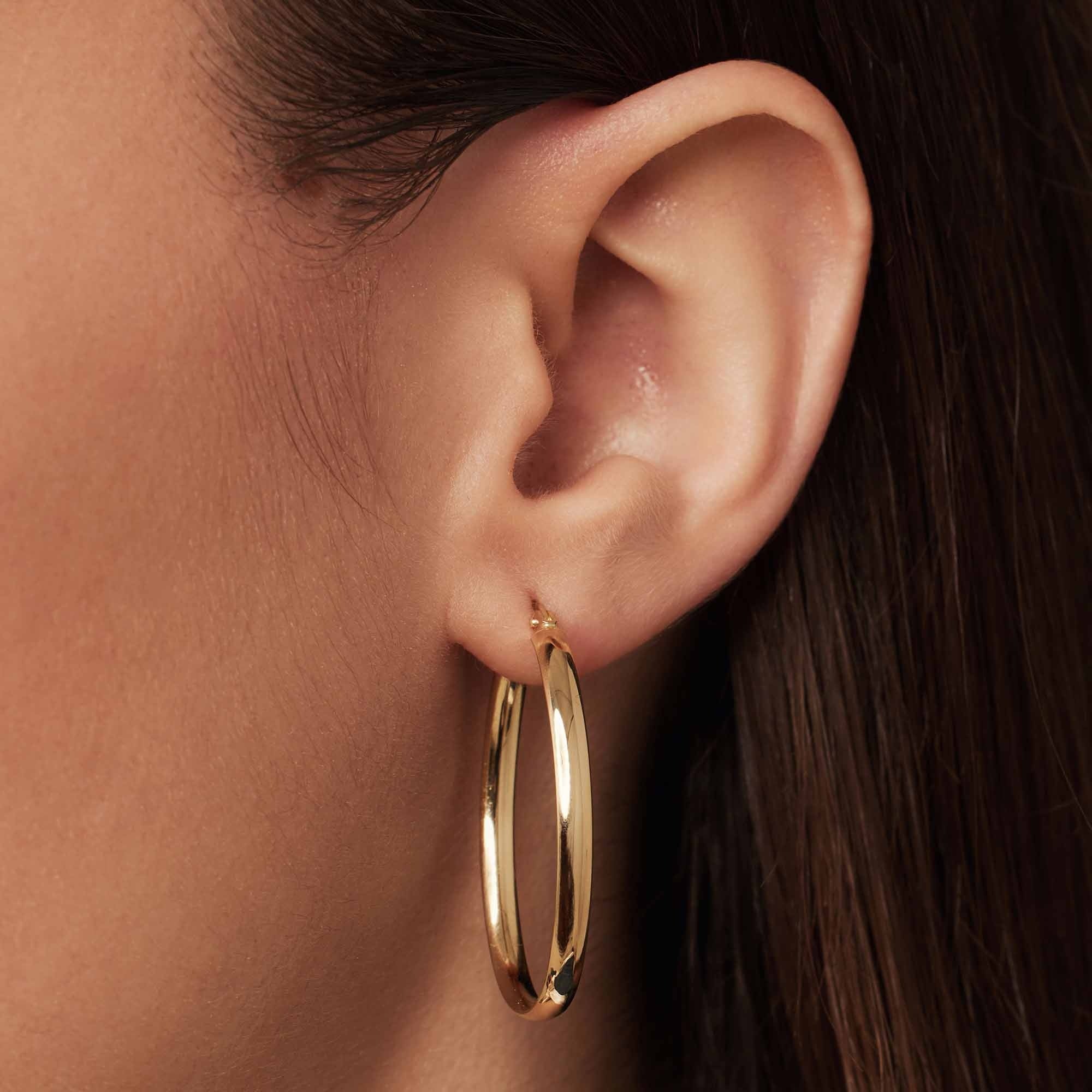 Rivoli Flori 14 karat gold oval hoop earrings (34 mm)