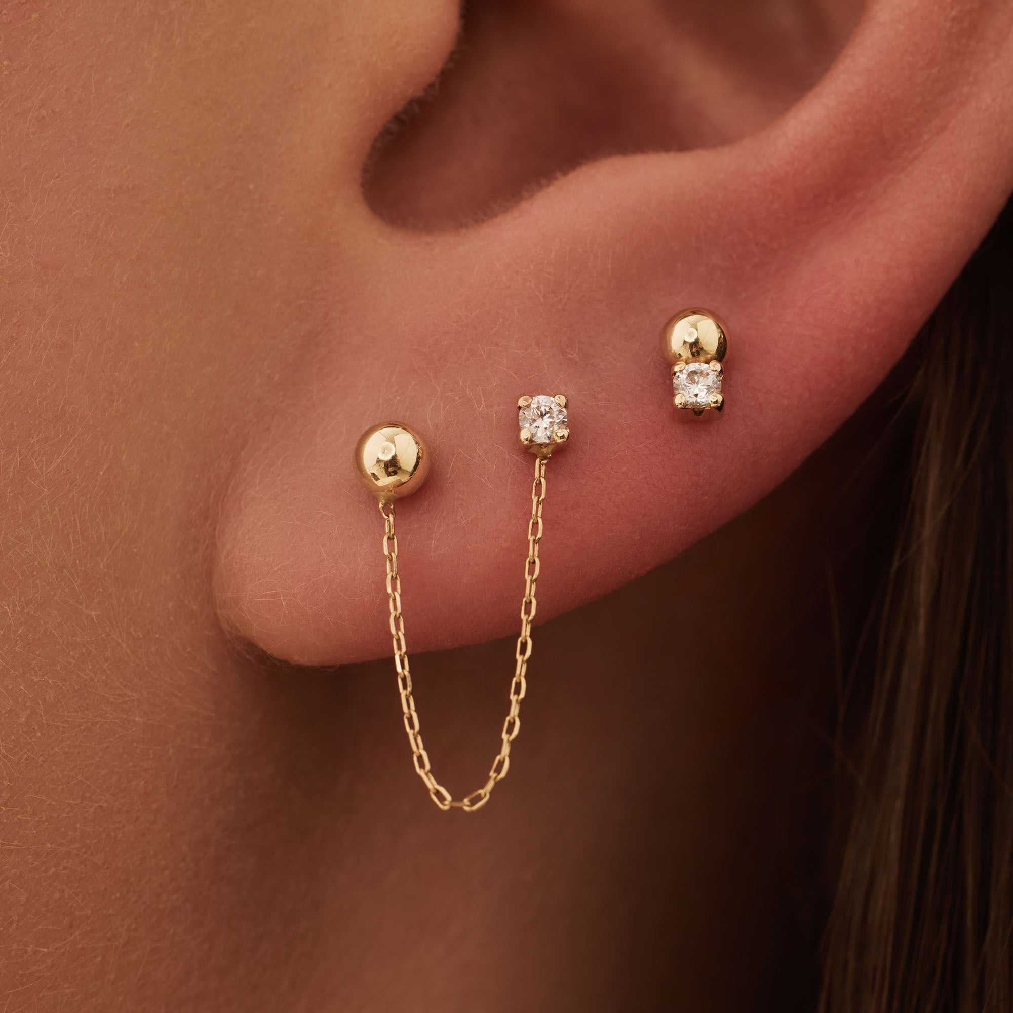 Rivoli Cézanne 14 karat gold earrings with 3 ear studs with zirconia